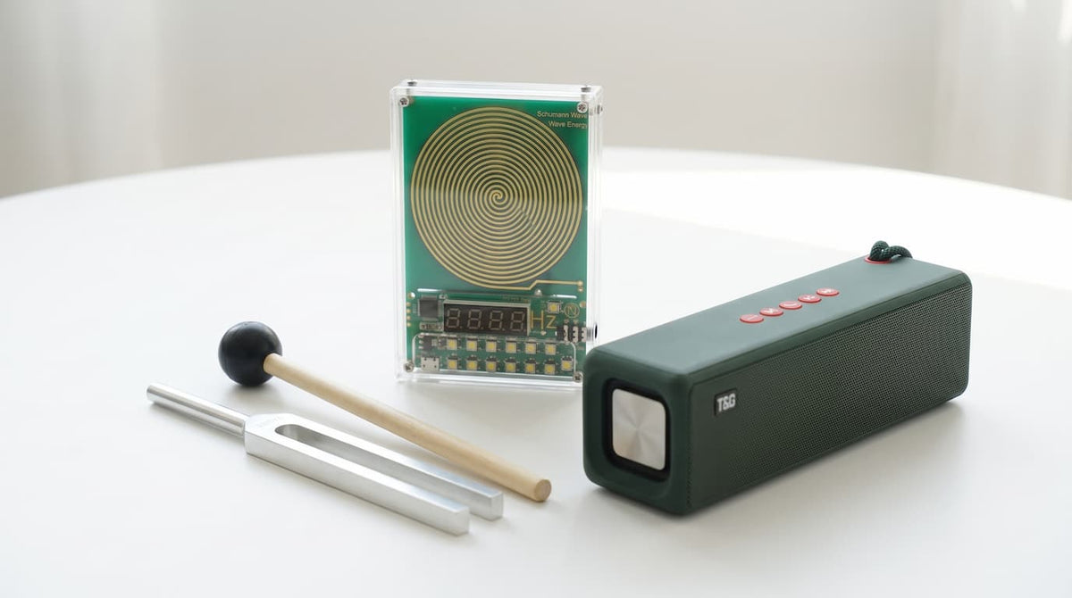 Amatro TrueWave on a table with a TrueNote tuning fork and the Amatro Vibrational Speaker